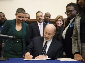 Pennsylvania Gov. Tom Wolf vetoes a bill passed by the Republican-controlled Legislature to limit abortions to the first 20 weeks of pregnancy at City Hall in Philadelphia, Monday, Dec. 18, 2017.