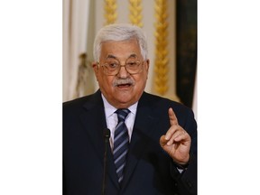 Palestinian President Mahmoud Abbas gestures during a joint press conference with French President Emmanuel Macron at the Elysee Palace after their talks in Paris, Friday, Dec. 22, 2017. Abbas visits France in the hopes that France takes a leading role in opposing the US recognition of Jerusalem as Israel's capital.