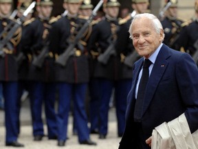 In this photo dated June 16, 2007, Jean d'Ormesson arrives at the Elysee Palace to attend the handover ceremony between French incumbent President Jacques Chirac and President-elect Nicolas Sarkozy, in Paris, France. Jean d'Ormesson, a very public face among the usually discreet "immortals" of the prestigious Academie Francaise, whom President Emmanuel Macron called a "prince of letters," has died. He was 92. (AP Photo)