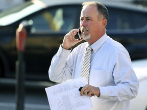 FILE- In this Aug. 31, 2017, file photo, District Judge Allen Sinclair arrives for the seventh day of preliminary hearings at the Centre County Courthouse in Bellefonte, Pa. Sinclair threw out involuntary manslaughter and aggravated assault charges against eight defendants in death of Tim Piazza in September. A hearing on Thursday, Dec. 7, will determine whether a new district judge will preside over what will be a second preliminary hearing, as prosecutors pursue reinstated criminal charges in the death of Piazza.