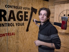 Anton Pushkari is seen at the Rage Montreal Axe Throwing Centre Tuesday, December 19, 2017 in Montreal. The huge lettering on the wall reads: "Control Your Rage", but when you drop in to the downtown club, you can forget about bringing along pictures of your boss for target practice.