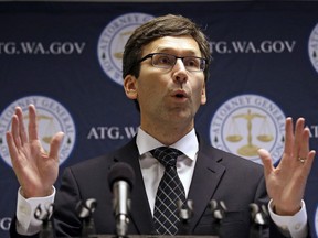 FILE- In this Nov. 28, 2017, file photo, Washington state Attorney General Bob Ferguson speaks at a news conference in Seattle. The state of Washington announced Thursday, Dec. 21, that it is expanding a lawsuit against cable and internet provider Comcast and accusing the company of discarding recorded customer service calls that the attorney general claims is evidence of the company's alleged deceptive sales practices.