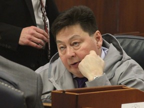 FILE - In this Jan. 17, 2017 file photo, state Rep. Dean Westlake, D-Kotzebue, talks with another legislator during a break in the opening session of the Alaska Legislature in Juneau, Alaska. Staff for Westlake, who was accused by several women of inappropriate behavior, hand-delivered his resignation letter to the House speaker's office on Friday, Dec. 15, 2017.