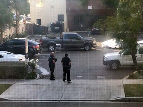 This photo provided by Basileus Zeno shows police at the scene of an active shooting in Long Beach, Calif. Friday, Dec. 29, 2017. Police say there are multiple victims at the scene but nothing about the number or their conditions.