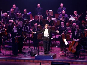 In this Friday Nov. 24, 2017 photo, conductor Johanna Weitkamp performs with the SAP orchestra in Mannheim, Germany.  Some big corporations think performing Beethoven symphonies helps employees team up on projects at work, with the orchestras serving as a public relations tool while helping forge the creative teamwork that companies need to compete in the business world.