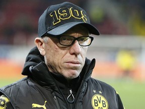 Dortmund's new coach Peter Stoeger gives an interview prior to a German first division Bundesliga soccer match between FSV Mainz 05 and Borussia Dortmund in Mainz, Germany, Tuesday, Dec. 12, 2017.