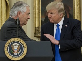 Rex Tillerson, U.S. Secretary of State, left, shakes hands with U.S. President Donald Trump during a swearing in ceremony in the Oval Office of the White House in Washington, D.C., U.S., on Wednesday, Feb. 1, 2017.