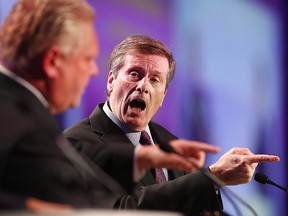 Doug Ford and John Tory speak at a debate at the Toronto Real Estate Board annual meeting at the Congress Centre in Etobicoke on Tuesday October 21, 2014.