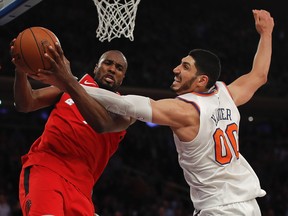 In this Nov. 22 file photo, New York Knicks centre Enes Kanter (right) battles Toronto Raptors forward Serge Ibaka for a rebound.
