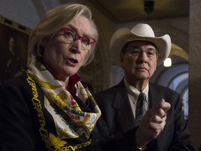 Chief Wilton Littlechild (right) looks on as Crown-Indigenous relations and northern affairs Minister Carolyn Bennett announces he will be the interim head of the governments National Council for Reconciliation in the Foyer of the House of Commons in Ottawa, Thursday December 14, 2017.