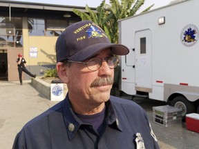 Capt. Brendan Ripley, a fire behavior analyst for the Ventura County Fire Department, talks about fire and Ventura history at an evacuation center for people fleeing the Thomas fire, at the Ventura County Fairgrounds in Ventura, Calif., Thursday, Dec. 7, 2017. Like many of the places that have seen repeated catastrophic fires, such as Malibu or Bel-Air, which continued to smolder from a fire that destroyed four homes Wednesday, it is an alluring place to live but one that is also prone to burn. "Part of it is the natural beauty of the area," said Ripley. "The brush-covered hills, the rock formations, the steep terrain ... all of that helps to promote very active fire behavior."