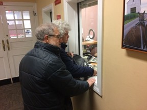Gail Trachtenberg and Lewis Eron prepay part of their 2018 property tax bill at the township building in Cherry Hill, New Jersey, on Thursday, Dec. 22, 2017. People across the country have been trying to prepay property taxes before a federal tax overhaul kicks in and caps deductions for state and local taxes.