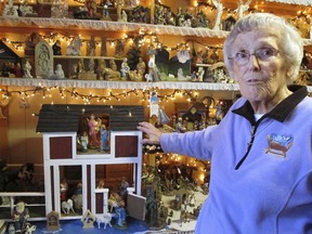 In this Wednesday, Dec. 20, 2017 photo Shirley Squires, of Guilford, Vt., speaks with a reporter about her collection of more than 1,400 nativity scenes on display in her home. Each Christmas, she gets help putting up the miniature scenes and then opens her home to school groups and others for viewing.