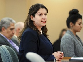 Lobbyist Vanessa Alarid, of Albuquerque, speaks at a meeting of state lawmakers on Friday, Dec. 15, 2017, in Santa Fe, N.M., about proposed revisions to the state Legislature's policy against sexual harassment. The New Mexico Legislature is rewriting its anti-harassment policy in response to concerns that widespread misconduct has gone unchecked. Alarid has accused a former lawmaker of pressuring her to have sex in exchange for support of one of her measures.