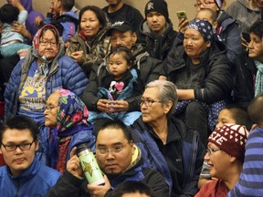 This Dec. 5, 2017, photo shows community members awaiting the arrival of Santa Claus at Saint Michael, Alaska, a remote island community off Alaska's western coast. The Alaska National Guard visited the Bering Strait community as part of its annual Operation Santa Claus, delivering Santa and Mrs. Claus and presents to rural Alaska communities.