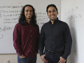 In this Wednesday, Dec. 13, 2017 photo, Yale graduate students Michael Lopez-Brau, left, and Stefan Uddenberg pose at Yale University in New Haven, Conn. The pair helped create an internet browser extension, "Open Mind," with students from Cal Tech and Waterloo University. The extension is designed to flag fake and biased news stories and provide the reader with alternatives.