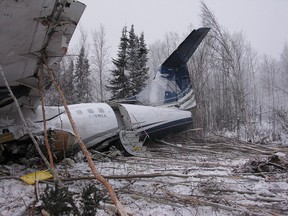 The wreckage of an aircraft is seen near Fond du Lac, Sask. on Thursday, December 14, 2017 in this handout photo.