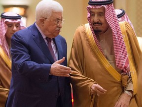 In this photo released by Al-Ekhbariya, Saudi King Salman, right, receives Palestinian President Mahmoud Abbas after he arrives in Riyadh, Saudi Arabia, Wednesday, Dec. 20, 2017.