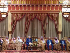 In this photo released by Al-Ekhbariya, Saudi King Salman, fifth right, receives Palestinian President Mahmoud Abbas after he arrives in Riyadh, Saudi Arabia, Wednesday, Dec. 20, 2017.