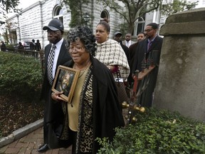 The parents of Walter Scott, Walter Scott Sr. and Judy Scott, leave the courthouse after former North Charleston police officer Michael Slager was sentenced to 20 years in prison for the 2015 shooting death of their son, Thursday, Dec. 7, 2017, in Charleston, S.C.