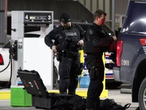 Officers were seen taking off body armour before getting into Waterloo regional police vehicles parked outside London police headquarters Friday morning. Police say there was an 'incident' at the Dundas Street building.