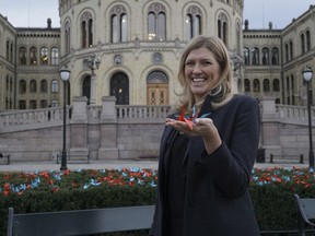 Beatrice Fihn, the executive director of the International Campaign to Abolish Nuclear Weapons (ICAN) holds two paper cranes in Oslo, Saturday, Dec. 9, 2017.