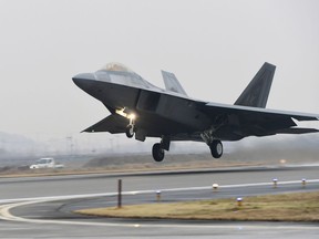 A U.S. Air Force F-22 Raptor takes off from a South Korean air base in Gwangju, South Korea, Monday, Dec. 4, 2017. The United States and South Korea have started their biggest-ever joint air force exercise with hundreds of aircrafts including two dozen stealth jets. (Yonhap via AP)