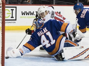 Ryan Dzingel of the Ottawa Senators scores the winning goal past New York Islanders netminder Jaroslav Halak during the third period of their game Friday night in New York.