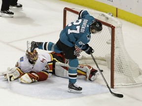 Joonas Donskoi of the San Jose Sharks scores the game-winning goal in the shootout past Calgary Flames goaltender David Rittich during NHL action Thursday night at the SAP Center at San Jose. The Sharks prevailed 3-2.