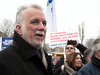 Quebec Premier Philippe Couillard walks with hundreds of people in support of the Davie Shipyard, Dec. 3, 2017.