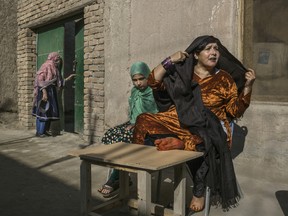 Meena, 11, with her mother, Shirin Gul, a convicted serial killer serving a life sentence, at Nangarhar provincial prison, in Jalalabad, Afghanistan, photographed on Dec. 2, 2017.