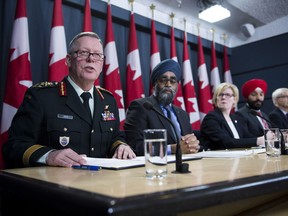 General Jonathan Vance, Chief of the Defence Staff (left to right) Defence Minister Harjit Sajjan, Carla Qualtrough, Minister of Public Services and Procurement, Navdeep Bains, Minister of Innovation, Science and Economic Development and Marc Garneau, Minister of Transport make an announcement on fighter jets at the National Press Theatre in Ottawa on Tuesday, Dec. 12, 2017.