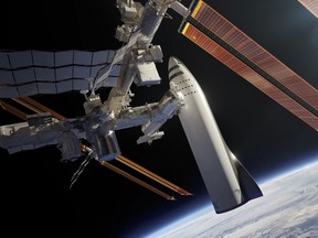 This artist's rendering made available by Elon Musk on Friday, Sept. 29, 2017 shows SpaceX's new mega-rocket design at the International Space Station.