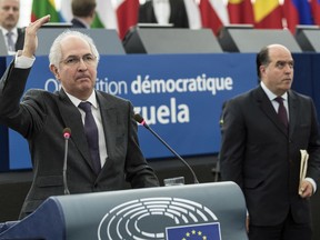 President of the Venezuelan parliament Venezuela Julio Borges, right, waits as ousted Caracas mayor Antonio Ledezma delivers his speech at the European Parliament in Strasbourg, eastern France, Wednesday, Dec.13, 2017. The 2017 Sakharov Prize for Freedom of Thought has been awarded to the democratic opposition in Venezuela. The award, named after Soviet dissident Andrei Sakharov, was created in 1988 to honor individuals or groups who defend human rights and fundamental freedoms.