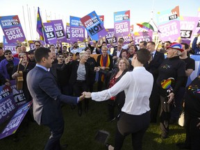 Same-sex marriage campaigners and volunteers cheer as they call on politicians to pass marriage equality legislation during rally outside Parliament House in Canberra, Australia, Thursday, Dec. 7, 2017. Gay marriage was endorsed by 62 percent of Australian voters who responded to a government-commissioned postal ballot by last month.