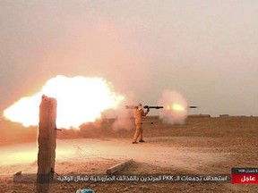 A photo published online purports to show an ISIL fighter firing his weapon during clashes with  U.S.-backed Kurdish-led Syrian Democratic Forces, in the northern Syrian province of Raqqa.