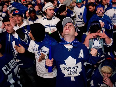 Fans react outside the Air Canada Centre late in the Leafs' Game 7 overtime loss to the Boston Bruins on May 13, 2013.