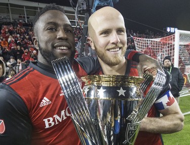 U.S. national team members Jozy Altidore, left, and Michael Bradley with the MLS Cup.