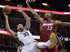 Memphis Grizzlies center Marc Gasol (33) shoots against Miami Heat center Bam Adebayo (13) in the second half of an NBA basketball game Monday, Dec. 11, 2017, in Memphis, Tenn.