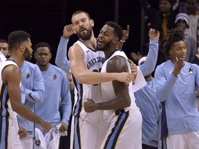 Memphis Grizzlies center Marc Gasol, center left, and forward JaMychal Green, center right, celebrate with teammates after an NBA basketball game against the Minnesota Timberwolves Monday, Dec. 4, 2017, in Memphis, Tenn. The Grizzlies won 95-92.