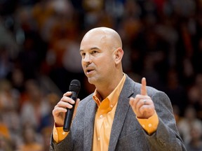 New Tennessee head football coach Jeremy Pruitt speaks to the audience before the first half of an NCAA college basketball game, Saturday, Dec. 9, 2017, in Knoxville, Tenn.