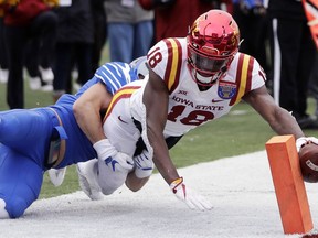 Iowa State wide receiver Hakeem Butler (18) reaches for the goal line but is knocked out of bounds at the 3-yard line by Memphis defensive back Austin Hall in the second half of the Liberty Bowl NCAA college football game Saturday, Dec. 30, 2017, in Memphis, Tenn.