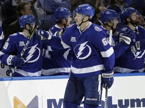 Tampa Bay Lightning defenseman Andrej Sustr (62) celebrates with the bench after his goal against the New York Islanders during the first period of an NHL hockey game Tuesday, Dec. 5, 2017, in Tampa, Fla.