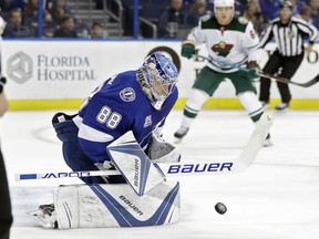 Tampa Bay Lightning goalie Andrei Vasilevskiy (88) makes a save on a shot by the Minnesota Wild during the first period of an NHL hockey game Saturday, Dec. 23, 2017, in Tampa, Fla.