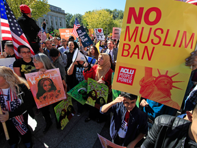 Protesters at a rally against the Trump administration's travel ban, Oct. 18, 2017 in Washington.