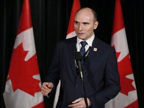 Minister of Families, Children and Social Development Jean-Yves Duclos speaks to reporters at a Liberal cabinet retreat in Calgary, Alta., Tuesday, Jan. 24, 2017.