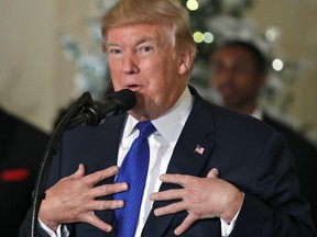 President Donald Trump speaks about tax reform in the Grand Foyer of the White House, Wednesday, Dec. 13, 2017, in Washington.