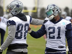 Dallas Cowboys wide receiver Dez Bryant (88) talks with running back Ezekiel Elliott (21) as they stretch together at NFL football practice in Frisco, Texas, Wednesday, Dec. 20, 2017.