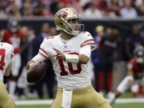 San Francisco 49ers quarterback Jimmy Garoppolo (10) throws against the Houston Texans during the first half of an NFL football game Sunday, Dec. 10, 2017, in Houston.