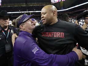 TCU coach Gary Patterson, left, and Stanford coach David Shaw greet each other at midfield after the Alamo Bowl NCAA college football game, Thursday, Dec. 28, 2017, in San Antonio. TCU won 39-37.